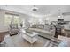 Living room and kitchen area with an open concept and lots of natural light at 305 Kentmere Ln, Clover, SC 29710