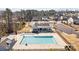 A large, bright pool with a covered pavilion area and parking in a neighborhood with mature trees and well-kept houses at 305 Kentmere Ln, Clover, SC 29710