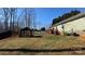 View of backyard, deck, lawn mower and gazebo with table and seating at 312 Sailwinds Rd, Mooresville, NC 28115