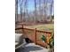 Backyard view from a deck with seating and a wooded lot at 312 Sailwinds Rd, Mooresville, NC 28115