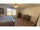 Bedroom with plenty of natural light, a ceiling fan, and hardwood dressers at 312 Sailwinds Rd, Mooresville, NC 28115