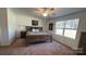 Cozy bedroom with a ceiling fan, a comfortable bed, and a bright window at 312 Sailwinds Rd, Mooresville, NC 28115