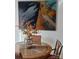 Dining area with round glass table and decorative artwork on the wall at 312 Sailwinds Rd, Mooresville, NC 28115