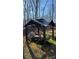 Gazebo with dining table, seating and grill with artificial turf at 312 Sailwinds Rd, Mooresville, NC 28115