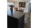 Modern kitchen island with countertop, hardwood floors, and dining area at 312 Sailwinds Rd, Mooresville, NC 28115