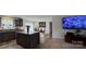 Open-concept kitchen with a large island, stainless steel appliances, and adjacent dining area at 312 Sailwinds Rd, Mooresville, NC 28115