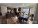 Bright kitchen with stainless steel appliances, center island, and adjacent dining space at 312 Sailwinds Rd, Mooresville, NC 28115