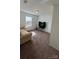 Bright living room with a modern television set, a comfortable couch, and natural lighting at 312 Sailwinds Rd, Mooresville, NC 28115