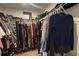 A walk-in closet with ample hanging storage for clothes, shoes, and handbags at 312 Sailwinds Rd, Mooresville, NC 28115