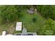 Aerial view of property showing sheds, solar panels, and green surroundings at 3199 Harmony Rd, Catawba, SC 29704