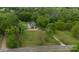 Expansive aerial view featuring a lush, tree-lined property with a charming home at 3199 Harmony Rd, Catawba, SC 29704