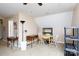 Spacious unfinished attic with a dormer window, neutral paint, and a ceiling fan at 3199 Harmony Rd, Catawba, SC 29704