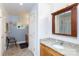 Bathroom featuring a single sink vanity, shower, tile flooring and a large mirror at 3199 Harmony Rd, Catawba, SC 29704