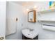 Bathroom featuring a vanity sink, shelving, mirror, and towel rack providing the perfect getting ready space at 3199 Harmony Rd, Catawba, SC 29704