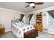 Bedroom features a ceiling fan, large windows, carpeted floors, and natural light at 3199 Harmony Rd, Catawba, SC 29704