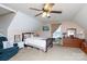 Cozy bedroom features a ceiling fan, dormer window and a comfortable chair at 3199 Harmony Rd, Catawba, SC 29704