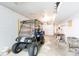Garage featuring a golf cart, work table, and storage, highlighting ample space for vehicles and hobbies at 3199 Harmony Rd, Catawba, SC 29704