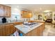 Bright kitchen with a center island, granite countertops, and modern appliances at 3199 Harmony Rd, Catawba, SC 29704