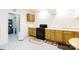 Basement kitchen featuring wooden cabinets, a black gas oven and neutral colored floors at 3199 Harmony Rd, Catawba, SC 29704
