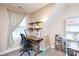 Well-lit office space featuring neutral paint, dormer window and light colored wooden shelves at 3199 Harmony Rd, Catawba, SC 29704