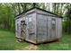 Rustic gray shed with a weathered wooden door and a secure, enclosed design at 3199 Harmony Rd, Catawba, SC 29704