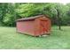 Sturdy red shed with simple design, offering practical storage in a yard setting at 3199 Harmony Rd, Catawba, SC 29704
