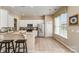 Well-lit kitchen with stainless steel appliances, white cabinetry, and an eat-in bar at 418 Garnet Ct, Fort Mill, SC 29708