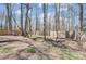 Fenced backyard with mature trees provides privacy and security for outdoor enjoyment at 4427 Brandie Glen Rd, Charlotte, NC 28269