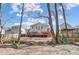 Enjoy the outdoors on a wooden deck in a backyard with mature trees and a privacy fence at 4427 Brandie Glen Rd, Charlotte, NC 28269