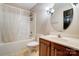 Bathroom features a shower-tub combo with vanity sink and decorative lighting at 4427 Brandie Glen Rd, Charlotte, NC 28269