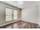 A bright bedroom with two windows and laminate wood flooring at 4427 Brandie Glen Rd, Charlotte, NC 28269
