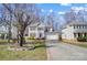 Inviting two-story home features a long driveway and beautiful landscaping at 4427 Brandie Glen Rd, Charlotte, NC 28269