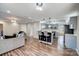 Open kitchen and living room area with stainless steel appliances and barstools at 4427 Brandie Glen Rd, Charlotte, NC 28269