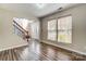 Bright and open living area with wood floors, stairs, and natural light at 4427 Brandie Glen Rd, Charlotte, NC 28269