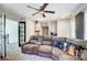 Cozy living room featuring a comfortable sectional sofa, ceiling fan, and access to the kitchen at 4427 Brandie Glen Rd, Charlotte, NC 28269