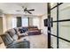 Cozy living room featuring a comfortable sectional sofa and a ceiling fan at 4427 Brandie Glen Rd, Charlotte, NC 28269