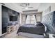 Stylish main bedroom with tray ceilings, a ceiling fan, natural light, and a flat-screen TV at 4427 Brandie Glen Rd, Charlotte, NC 28269