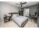 Bedroom with neutral color scheme, ceiling fan, and window letting in natural light at 4729 Abercromby St, Charlotte, NC 28213