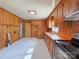 Functional kitchen with wood cabinetry and plenty of counter space. Door to laundry at 4800 Kipling Dr, Charlotte, NC 28212