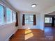 Inviting room with hardwood floors, and large windows providing plenty of natural light at 4800 Kipling Dr, Charlotte, NC 28212