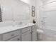 A well-lit bathroom featuring a single sink vanity and shower-tub combination at 491 Creevy Nw Dr, Concord, NC 28027