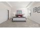 Spacious main bedroom features tray ceiling, carpeted floors, and bright windows for natural light at 491 Creevy Nw Dr, Concord, NC 28027