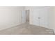Bedroom features neutral color palette, and carpeted floor, and closet at 491 Creevy Nw Dr, Concord, NC 28027
