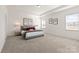 Spacious main bedroom features tray ceiling, carpeted floors, and bright windows for natural light at 491 Creevy Nw Dr, Concord, NC 28027