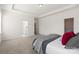 Spacious bedroom with tray ceiling, carpeted floor and adjacent bathroom and walk-in closet at 491 Creevy Nw Dr, Concord, NC 28027