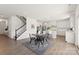Open concept dining area with modern light fixtures, black dining set and stairs at 491 Creevy Nw Dr, Concord, NC 28027