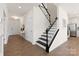 Inviting entryway with staircase and open concept view of the kitchen at 491 Creevy Nw Dr, Concord, NC 28027