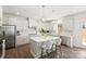 Gorgeous kitchen island with stainless steel appliances, white subway tile backsplash, and pendant lights at 491 Creevy Nw Dr, Concord, NC 28027