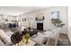 Open-concept living room featuring a fireplace and hardwood floors at 491 Creevy Nw Dr, Concord, NC 28027