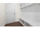 Mudroom with door, hooks, shelves, bench and flooring at 491 Creevy Nw Dr, Concord, NC 28027